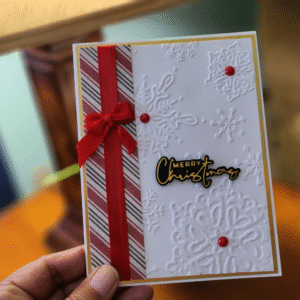 Elegant Embossed Snowflake Christmas Card with Red Bow Description: